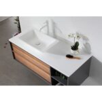 The Goreme 48 Inch Wall Mount Bathroom Vanity With Vessel Sink features a modern design with a white vessel sink, tall faucet, orchid plant, hairbrush on wooden drawers and open shelves, all atop light gray tile flooring.