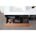 The Goreme 48 Inch Wall Mount Bathroom Vanity With Vessel Sink features an open drawer showing organized compartments for a hairbrush, bottles, round containers, a soap box, and a folded towel.