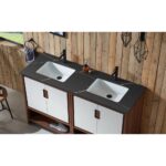 The Lyon 60 Inch Double Bathroom Vanity with Top features a dark countertop, white rectangular sinks, black faucets, wooden base, and a slatted wood wall backdrop, complemented by pendant lights and a window on the left.