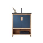 The Lyon 30 Inch Bathroom Vanity with Top includes a modern black sink and faucet, blue doors with wooden handles, a wood shelf for towels, and is topped with a small glass vase holding dried flowers.