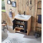 A modern bathroom features the Lyon 30 Inch Bathroom Vanity with Top, paired with a black faucet. Open cabinet doors reveal neatly folded towels and toiletries, set against wood-paneled walls with decorative frames and hanging towels nearby.