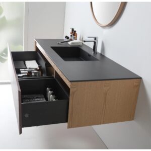 The Oslo 60 Inch Wall Mount Single Bathroom Vanity features a black countertop, integrated sink, wood finish, and two open drawers displaying towels and toiletries, set against a white wall with a round mirror above.