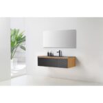 A modern bathroom features the Oslo 48 Inch Wall Mount Bathroom Vanity with a black countertop and faucet, toiletries, a large rectangular mirror, white walls, and a green potted plant in the corner.