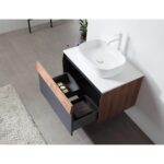 The Ronda 30 Inch Wall Mount Bathroom Vanity with vessel sink features wood and black drawers, partially open to reveal towels and toiletries, set against a gray tiled floor with a rug and plant in the background.