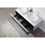 The Ronda 55 Inch Wall Mount Vanity with Double Vessel Sinks showcases open drawers with organized compartments, set on a gray tile floor near a beige rug. A small plant brings freshness to the modern bathroom decor.
