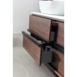 A close-up of two partially open drawers with black handles in the Sintra 55 Inch Wall Mount Vanity with Double Vessel Sinks reveals toiletries inside. The vanity is set against a light-toned tiled floor.