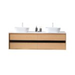 The Sintra 72 Inch Wall Mount Vanity with Double Vessel Sinks offers a modern floating design, light wood finish, four drawers, sleek black accents, and accessories conveniently placed between two white vessel sinks.