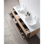 The Sintra 72 Inch Wall Mount Vanity with Double Vessel Sinks includes wooden drawers for organized storage, displayed above a light gray tile floor and a textured beige rug.