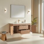 Modern bathroom showcasing a Linea 48 Inch Wall Mounted Bathroom Vanity with open drawers and cabinet, rectangular mirror, two wall sconces, a plant, and abundant natural light from large windows. A small wooden stool by the vanity holds a book.