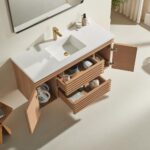 The Linea 48 Inch Wall Mounted Bathroom Vanity features a white countertop, gold faucet, and open drawers and cabinet doors displaying neatly organized toiletries and towels against a light-colored wall and floor.