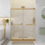 A modern shower featuring the Shower Door Double Sliding Frameless with gold hardware, white brick wall tiles, a rainfall showerhead, minimalist decor, visible green plants, and a gold faucet near the tub.
