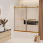 Modern bathroom with the Tub Door Double Sliding Frameless, gold fixtures, black recessed shelf, round mirror, wood vanity with sink, pampas grass in a vase, and a small wooden stool topped with a candle.
