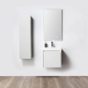 Minimalist bathroom with the Positano 20 inch Wall Mount Vanity With Sink, a coordinating wall cabinet, rectangular mirror, and wood floors. The vanity holds a soap dispenser, toothbrush holder, and small bottle.