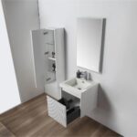 A modern bathroom showcases the Positano 20 inch Wall Mount Vanity With Sink, paired with a rectangular basin, an open drawer, a mirrored cabinet with shelves holding toiletries, and light wood flooring.