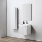 A minimalist bathroom features the Positano 20 inch Wall Mount Vanity With Sink, a rectangular basin, wall-mounted cabinet, and large mirror. Light wood plank flooring and plain white walls create a clean, modern style.
