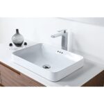 A modern rectangular white vessel sink sits on the Orsa 48 Inch Wall Mount Bathroom Vanity With Vessel Sink, featuring a chrome faucet, white countertop, and wooden cabinet below. A gray decorative vase and two small containers sit beside the sink.