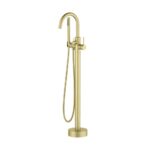 The Halo Floor Mount Tub Filler With Hand Shower boasts a gold curved spout, single lever handle, and a flexible hose with an attached handheld shower head for modern style and functionality.