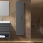 Modern bathroom with a floating gray vanity, rectangular mirror, Cartisan Design Side Cabinets, and a shower area highlighted by warm ambient lighting.