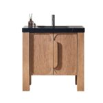 The Munich 36 Inch Bathroom Vanity with Top features rectangular legs, curved cabinet doors, a black countertop with built-in sink and faucet, plus accessories, all set against a white background.