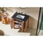 The Munich 36 Inch Bathroom Vanity with Top features a black countertop, white rectangular sink, and wooden cabinet with open doors showing neatly organized towels and bathroom essentials on the shelves.
