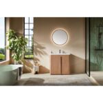 Modern bathroom featuring the Parma 36 Inch Bathroom Vanity With Top, a round backlit mirror above the wooden cabinet, large window, potted plant, freestanding tub, glass shower, and a neutral rug on the floor.