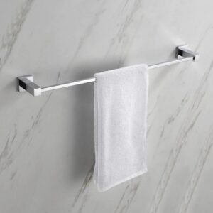 A white towel neatly hangs on the modern Quadra Bathroom Towel Bar, which is mounted on a light-colored marble wall.