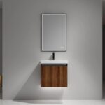 The Lille Wall Mounted Bathroom Vanity features a minimalist design with a vertical-grooved wooden cabinet, a rectangular mirror above the wall-mounted sink, and a modern, uncluttered look set against a plain gray wall.