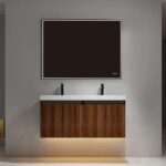 A modern bathroom features the Lille Wall Mounted Bathroom Vanity with double sinks, black faucets, illuminated under-cabinet, and a large dark-framed mirror on a light gray wall.