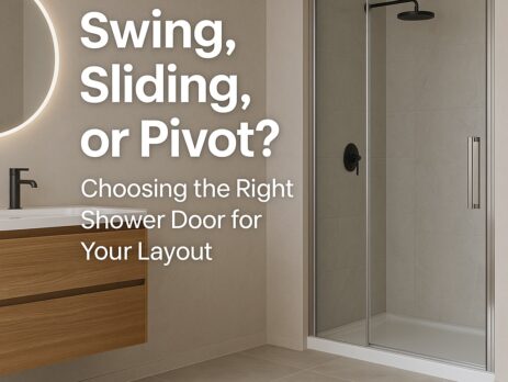 Modern bathroom with a wooden vanity, round mirror, and glass shower enclosure. Text reads: Swing, Sliding, or Pivot? Choosing the Right Shower Door for Your Layout.