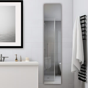Modern bathroom featuring a white vanity, framed wall art, and the Royale 15 inch ×70 inch Side Tall Medicine Cabinet reflecting a glass shower. A black towel rack with white towels adds to the minimalist, clean decor.
