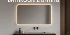 A modern bathroom with a floating wooden vanity, black sink, accessories, and a large rectangular LED mirror glowing softly. Text above reads, “WHY LED MIRRORS ARE THE FUTURE OF BATHROOM LIGHTING.”.