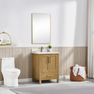 A modern bathroom featuring the Basel 24 Inch Bathroom Vanity with sink and mirror, a white toilet, towel basket, wall shelves with decor, and a neutral palette of beige paneling and a light gray rug.