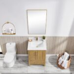 A modern bathroom includes the Basel 24 Inch Bathroom Vanity, a white sink, gold faucet, rectangular mirror, toilet, round wall shelf with toiletries, and a woven basket with towels on a marble floor.