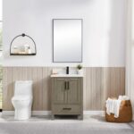 A modern bathroom includes a toilet, the Basel 24 Inch Bathroom Vanity with sink, a rectangular mirror, a round shelf with toiletries, a window, and a wicker basket of towels on a marble floor.