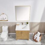 Modern bathroom with a Basel 30 Inch Bathroom Vanity and sink, gold faucet, square mirror, potted plant, towel basket, and toiletries on a wall shelf. Marble tile floor and light wood wall paneling complete the elegant look.