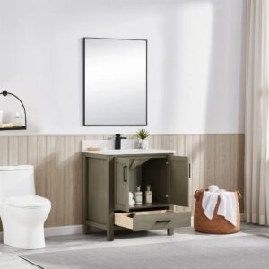 Modern bathroom with a toilet, a Basel 30 Inch Bathroom Vanity featuring an open cabinet and drawer displaying toiletries, a large mirror above, a basket of towels, a wall sconce, and natural light through sheer curtains.