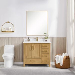 A modern bathroom showcases the Basel 36 Inch Bathroom Vanity with a white countertop and rectangular mirror above. A toilet and gold shelf with toiletries are to the left, while a towel-filled basket sits near a sunlit window on the right.