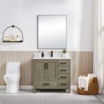 A modern bathroom features a Basel 36 Inch Bathroom Vanity with sink and drawers, white toilet, large square mirror, wall shelf with toiletries, wicker laundry basket, light wood wall panels, and a curtain.