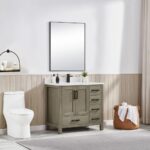 Modern bathroom with a Basel 36 Inch Bathroom Vanity, drawers, large mirror, white countertop, and refined decor. A toilet is on the left; a wicker towel basket sits on the right near light curtains.