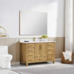 A modern bathroom includes the Basel 48 Inch Bathroom Vanity topped with a large rectangular mirror, a white toilet, a woven towel basket, and a window with white curtains letting in natural light.
