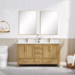 A modern bathroom featuring a Basel 60 Inch Double Bathroom Vanity with double sinks, two rectangular mirrors above, gold fixtures, a toilet to the left, a small wall shelf, and a towel basket on the right. A plant sits on the vanity.