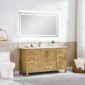 A modern bathroom featuring the Basel 60 Inch Single Bathroom Vanity, a double sink, large rectangular backlit mirror, white toilet, gold faucet, and a wicker basket with towels beside a window dressed in white curtains.