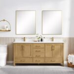 A modern bathroom features a Basel 72 Inch Double Bathroom Vanity with gold fixtures, two large mirrors, a plant, soap dispensers, a white toilet, and a shelf with toiletries. The walls are half-paneled with light wood.