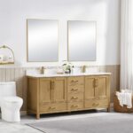 A modern bathroom features a Basel 72 Inch Double Bathroom Vanity with two rectangular mirrors above, a white toilet, a towel ring with a hanging towel, and a basket of towels on the floor, all illuminated by natural light.