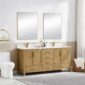 A modern bathroom features a Basel 72 Inch Double Bathroom Vanity with two rectangular mirrors above, a white toilet, a towel ring with a hanging towel, and a basket of towels on the floor, all illuminated by natural light.