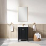 A minimalist bathroom featuring the Torino 24 Inch Bathroom Vanity Cabinet with a white sink, rectangular mirror above, gold towel rings with white towels on each side, a woven basket with rolled towels to the right, and light wood paneled walls.
