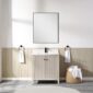 A minimalist bathroom features a rectangular mirror above the Torino 30 Inch Bathroom Vanity Cabinet in light wood, flanked by towel rings with white towels. A wicker basket with rolled towels sits on the tiled floor beside the vanity.