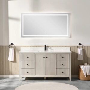 A modern bathroom showcases the Torino 60 Inch Single Bathroom Vanity with multiple drawers and a central cabinet, topped by a large illuminated mirror. Neutral, minimal decor includes towels on both sides and rolled towels on stools.