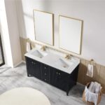 A modern bathroom features the Torino 60 Inch Double Bathroom Vanity Cabinet with a white marble countertop, two gold-framed rectangular mirrors, gold faucets, towel rings with white towels, and a basket of rolled towels on a marble floor.
