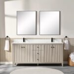 A modern bathroom features the Torino 72 Inch Double Sink Bathroom Vanity Cabinet, two large rectangular mirrors, black faucets, white towels on towel rings, a wicker basket with towels, and light wood accents in neutral tones.